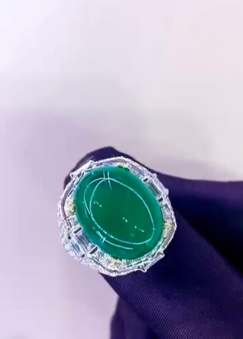 Unique and elegant Emerald and Diamonds ring.
The Emerald is arranged in the shape , surrounded by shimmering diamonds that add a touch of sophistication.
The intricate craftsmanship and vibrant colors make this ring a truly special and eye-catching