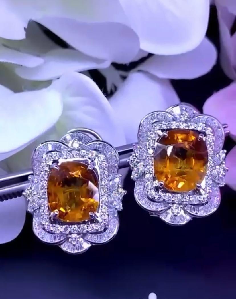 Oval Cut AIG Certified 18.50 Carats Orange Sapphires  3.56 Ct Diamonds 18K Gold Earrings  For Sale