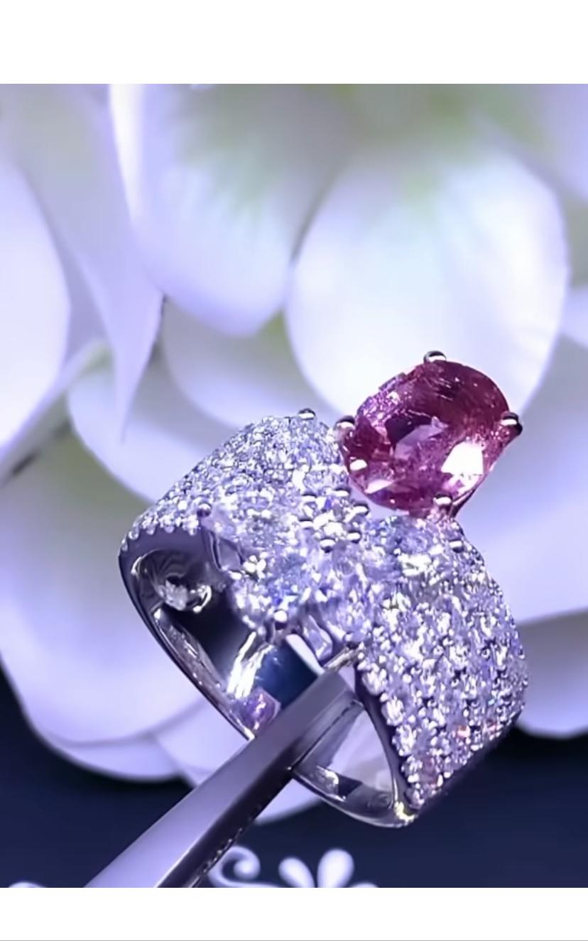 A gorgeous ring in sophisticated design, so elegant and refined, a very glamour style, by Italian designer. Piece of modern art .
Ring come in 18K gold with a Natural Unheated Padparadscha Sapphire, rare stone , extra fine quality, spectacular color