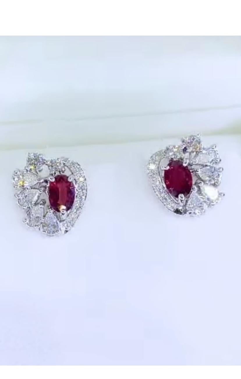 Introducing an exquisite pair of earrings featuring striking Siamese Rubies and dazzling diamonds. This captivating piece, crafted to perfection.
Immerse yourself in the luxurious beauty of this mesmerizing earrings, exuding elegance and
