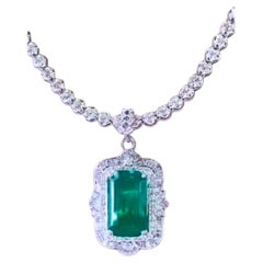 AIG Certified 20.00 Carat Zambian Emerald  2.50 Carat Diamonds 18K Gold Pendant