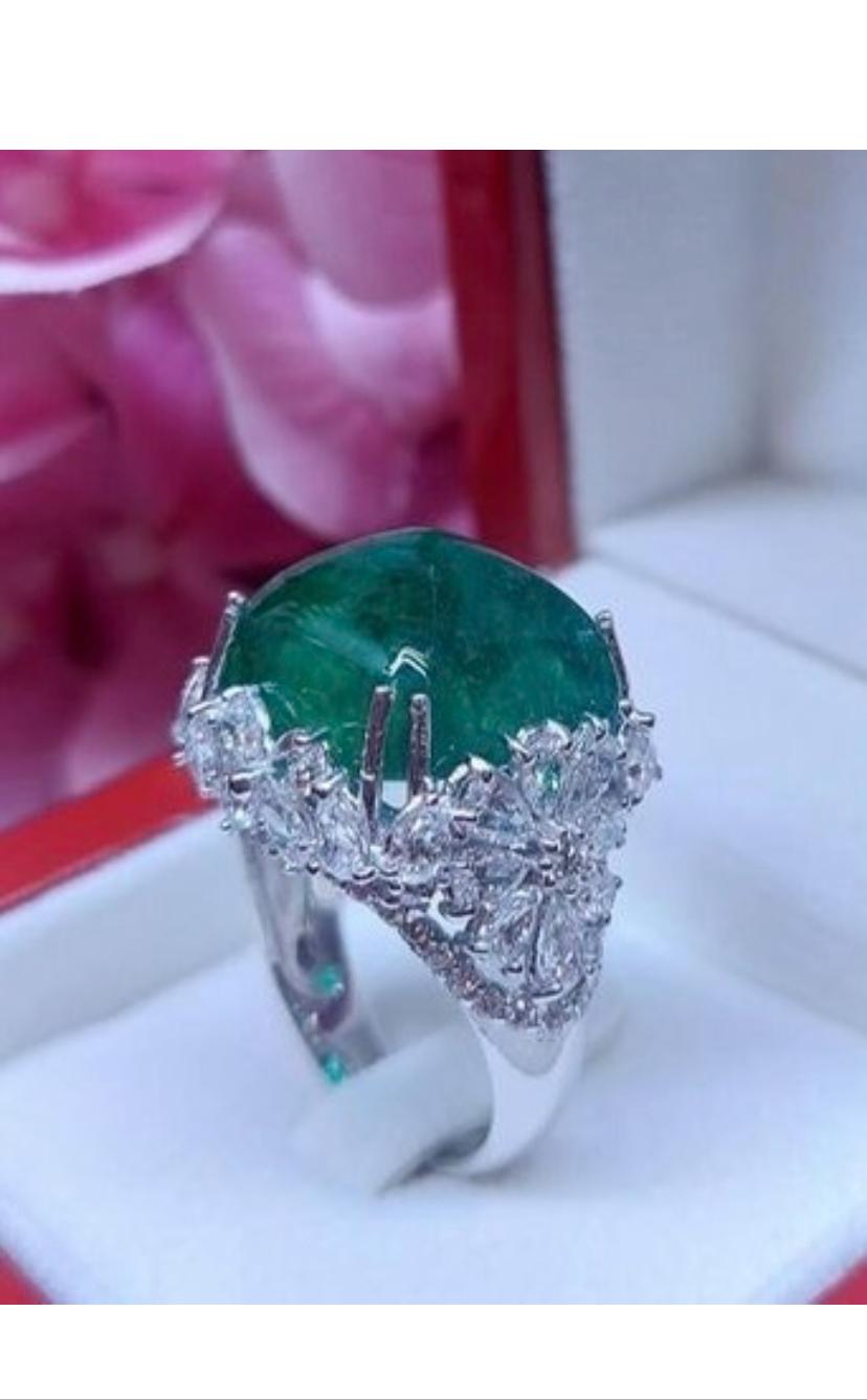 A master piece , so impressive , unique piece in the world. Flowers design is so sophisticated, particular, a very piece of art .
Ring come in 18k gold , with a central Natural Zambian Emerald , in perfect cabochon cut , so big face , extra fine