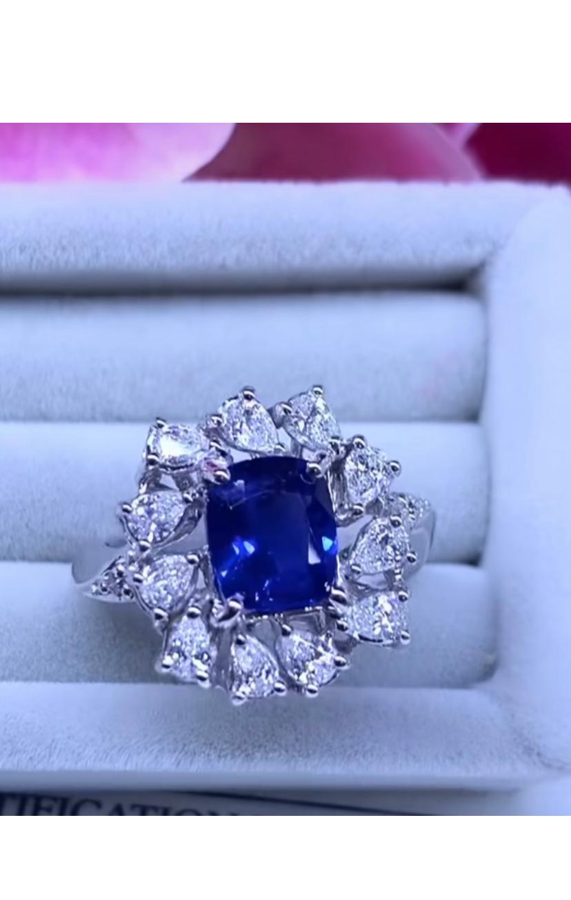 From amazing flowers collection, an exquisite ring handmade by Italian designer .
Ring come in 18k gold with a natural unheated Ceylon sapphire, spectacular color and grade, fine quality, 2,08 carats, and 11 pieces of natural diamonds in pear cut of
