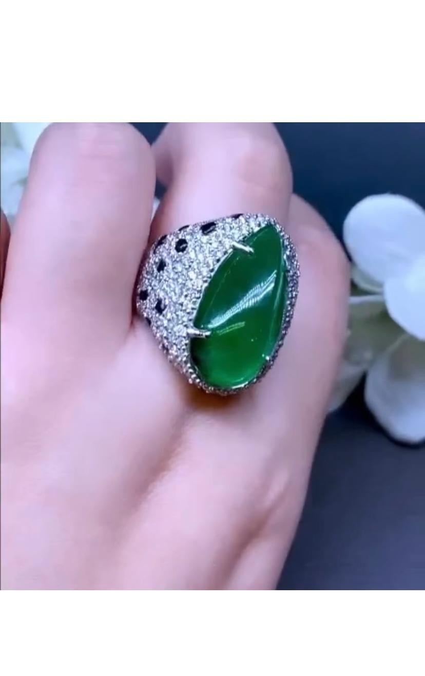An exclusive ring in  contemporary style, so modern and impressive , a very sophisticated , glamour design, a very piece of art.
Ring come in 18k gold with a natural Zambian Emerald, in perfect pear cabochon cut , fine quality, spectacular vivid