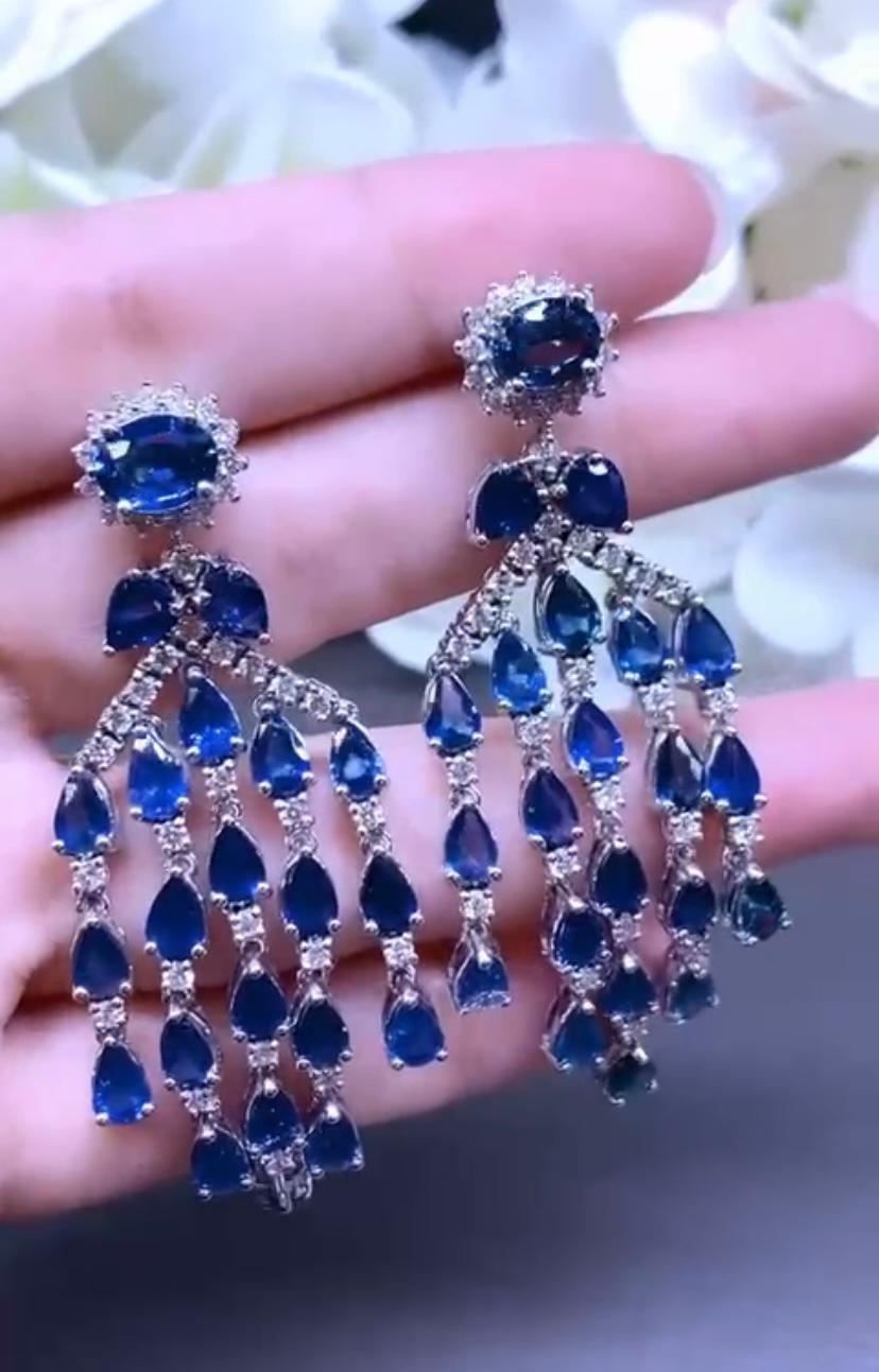 An exclusive earrings with a refined design, so glamour and fashion style.
Earrings come in 18k with 44 pieces of natural Ceylon Sapphires, extra fine quality, in perfect oval and drop cut , of 24,32 carats, spectacular blue, and 76 pieces of