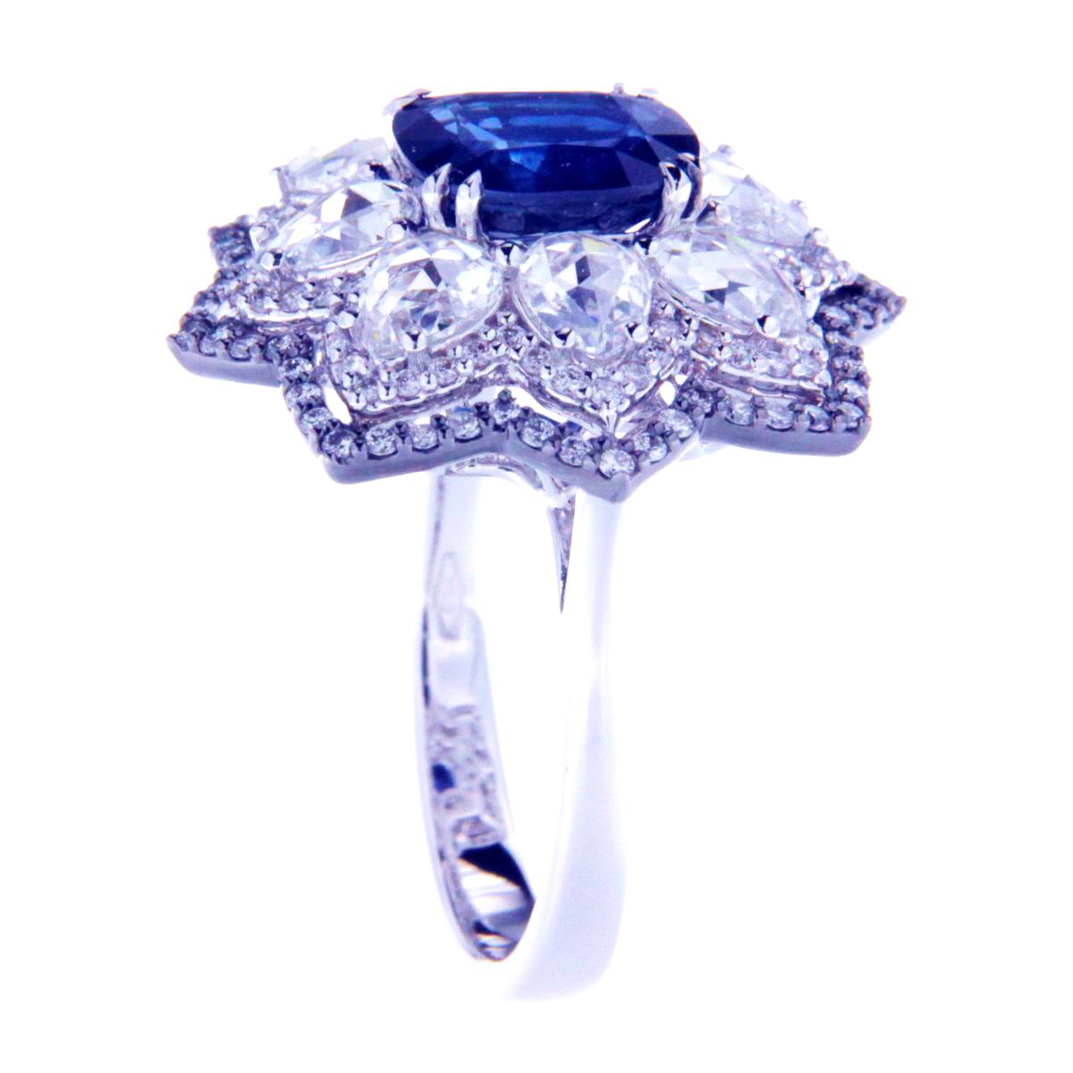 Beautiful ring consists of white gold with 2.58 Carats Cornflower Blue Cushion Cut Natural Sapphire. Surroundins the main stone are white gold bead set 2.04 Carats Natural Diamonds Round Brilliant Cut and Pear Rose Cut. Ring accompanied by a