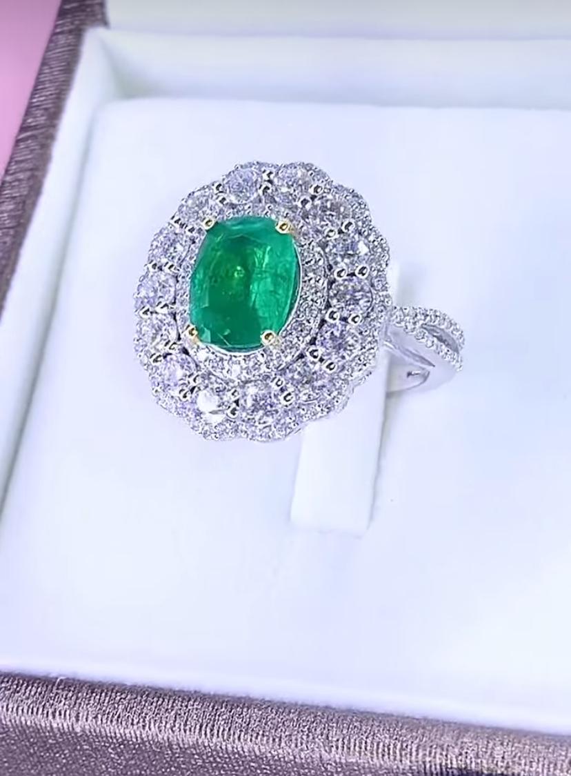 Oval Cut AIG Certified 2.60 Ct Zambian Emerald 2.50 Ct Diamonds 18K Gold Ring For Sale