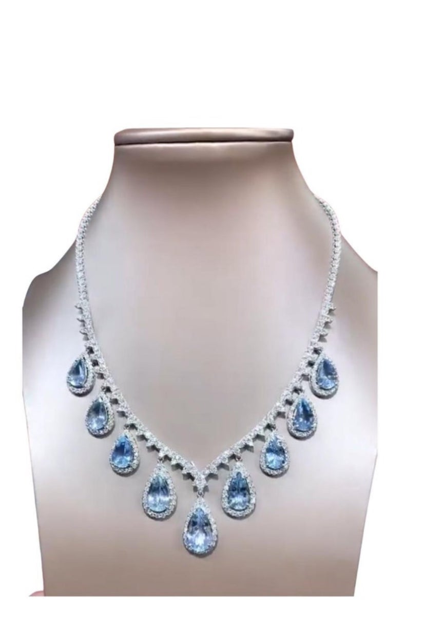An exquisite Aquamarine and Diamonds pair of earrings.
Aquamarines are stunning gemstones known for their calming blues hues, reminiscent of the clear waters of the ocean. They are believed to bring peace ,tranquility, and clarity to the wearer,