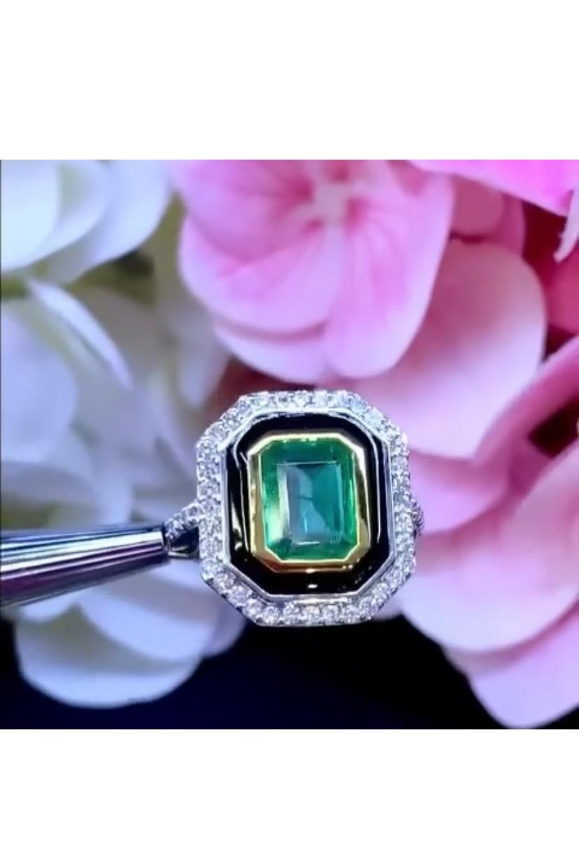 An exclusive Art Deco design, so particular and refined style, a very piece of art .
Ring come in 18k  gold with a Natural Zambian Emerald , extra fine grade and quality, spectacular vivid green , of 2,75 carats, and Natural Diamonds in round