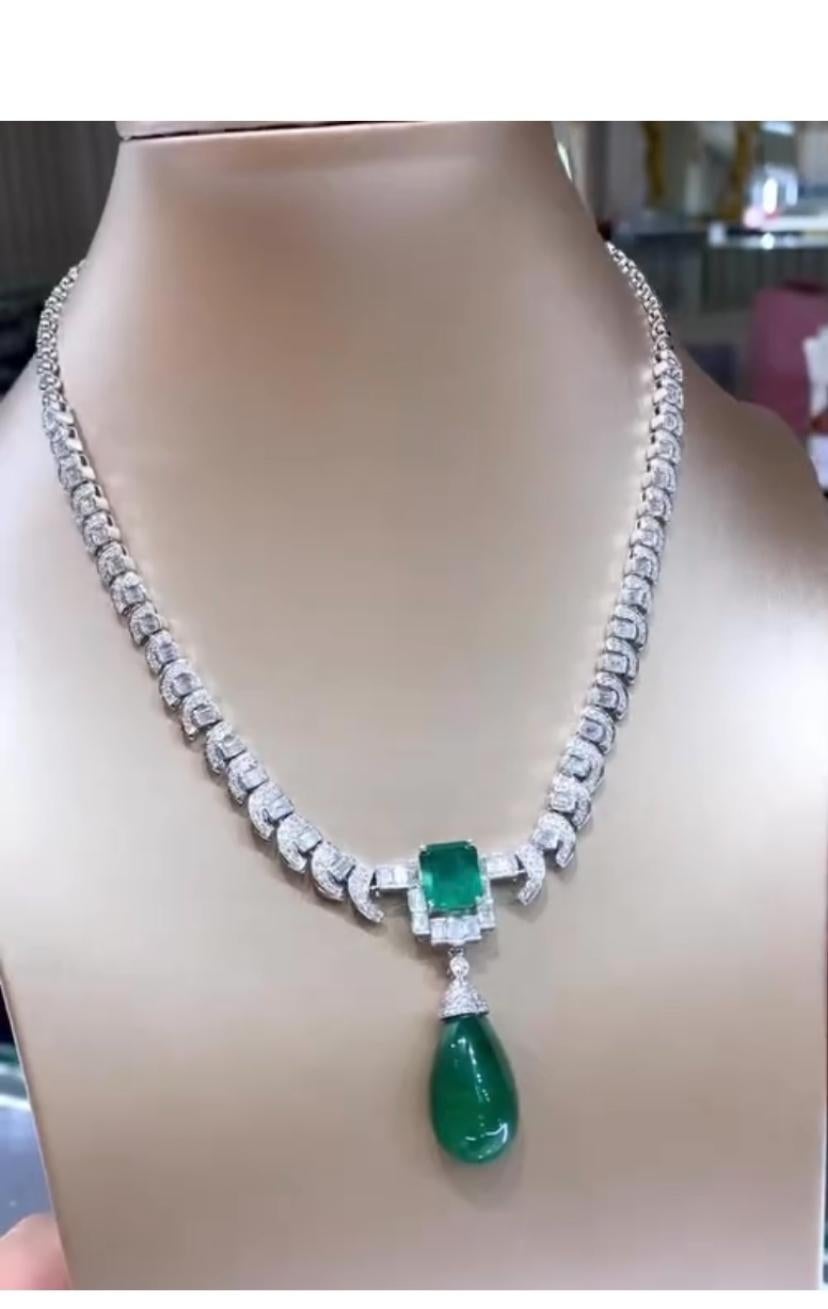 A timeless piece of Emerald and Diamonds necklace.
The lustrous cabochon cut Zambian Emerald gem is truly captivating, while the dazzling diamonds illuminate like bursts of exquisite fireworks.
Experience the allure and grace of this extraordinary 