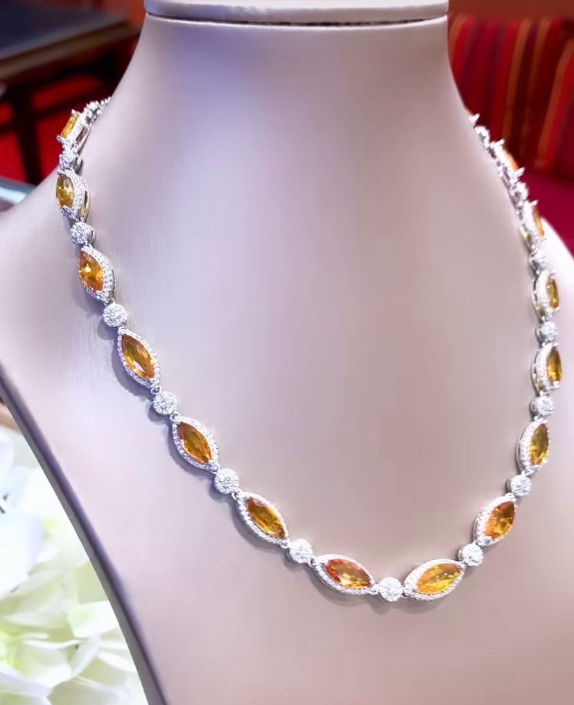 A magnificent Parure in contemporary design , so stunning and refined, a very masterpiece for sophisticated ladies.
Necklace come in 18k gold with 15 pieces of superbe natural orange Sapphires of 22.86 carats, in perfect marquise cut , spectacular