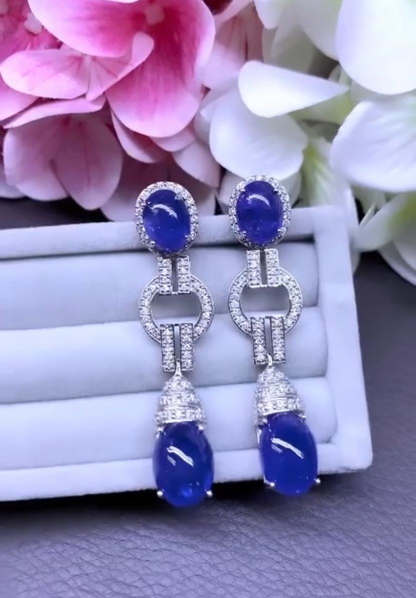 An exclusive Art Deco design, so elegant and unique style, very sophisticated , fashion.
Earrings come in 18K gold with 4 pieces of Natural Tanzanites from Tanzania, in extra fine quality, spectacular color, in perfect oval/cabochon cut of 30,80