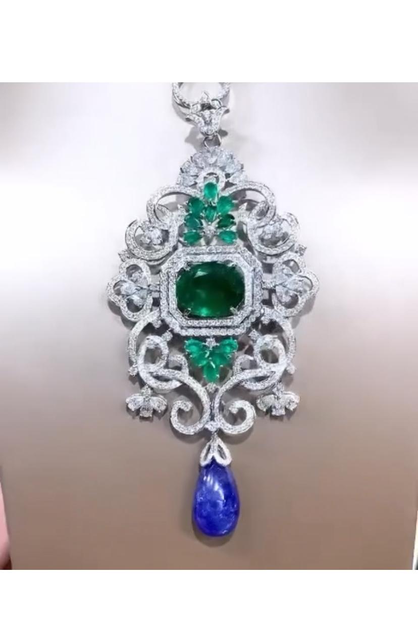 Mixed Cut AIG Certified 32.00 Ct Tanzanite 15.00 Ct Emerald 12 Ct Diamonds Brooch/Pendant  For Sale