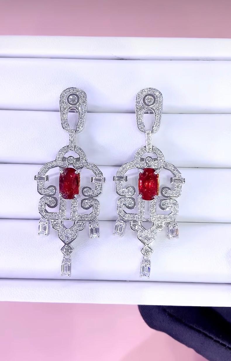 An exquisite Rubies and Diamonds in Art Deco design, in refined and elegant style.
Elevate your timeless of beauty and add a touch of glamour and sophistication.
Magnificent earrings come in 18k gold with a Unheated Mozambique Rubies of 3,45 carats,