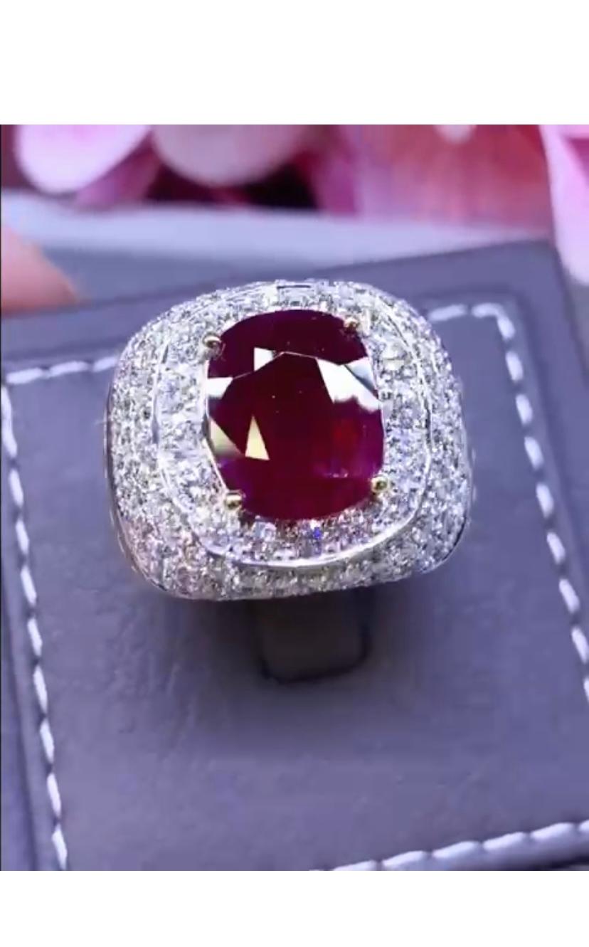 An exquisite ring in contemporary design , so modern and stunning style.
Ring come in 18k gold with a oval cut natural Mozambique Ruby  of 3,65 , extra fine quality, and round brilliant cut diamonds of 3,28 carats ,F/VS, top quality.
Handcrafted by