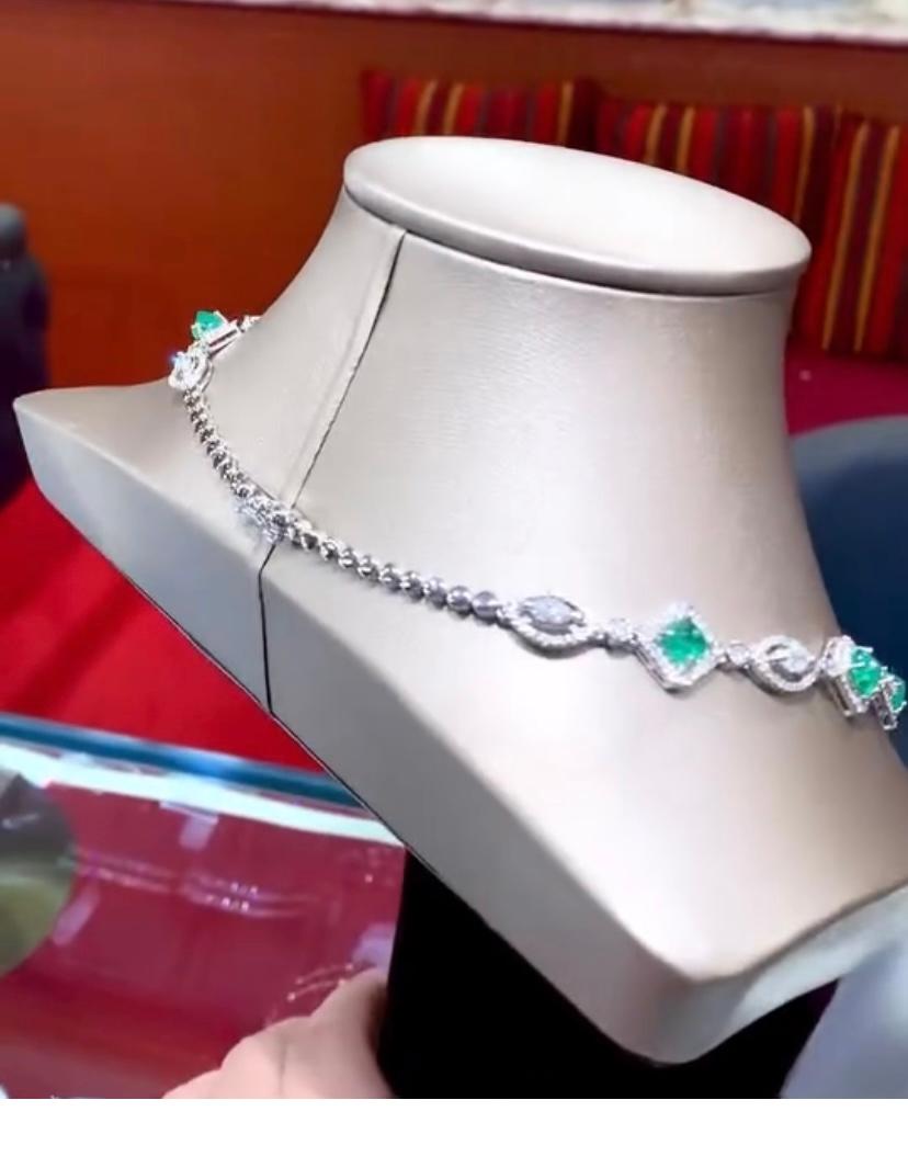 This exquisite necklace showcases a majestic 23,00 carat Zambian Emerald , radiant and striking.
Accented by shimmering marquise cut diamonds , it embodies elegance and luxury . making it a stunning collection piece that captures the essence of