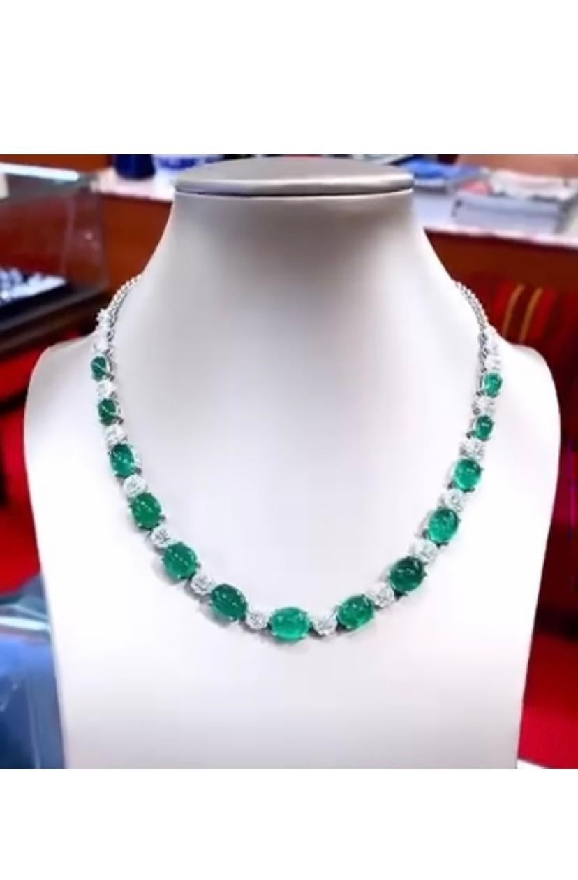 A stunning necklace features a breathtaking Emeralds .
The necklace is further adorned with vibrant emeralds and diamonds, adding a touch of glamour and sophistication to the already magnificent piece.
Truly a statement of luxury and style. The