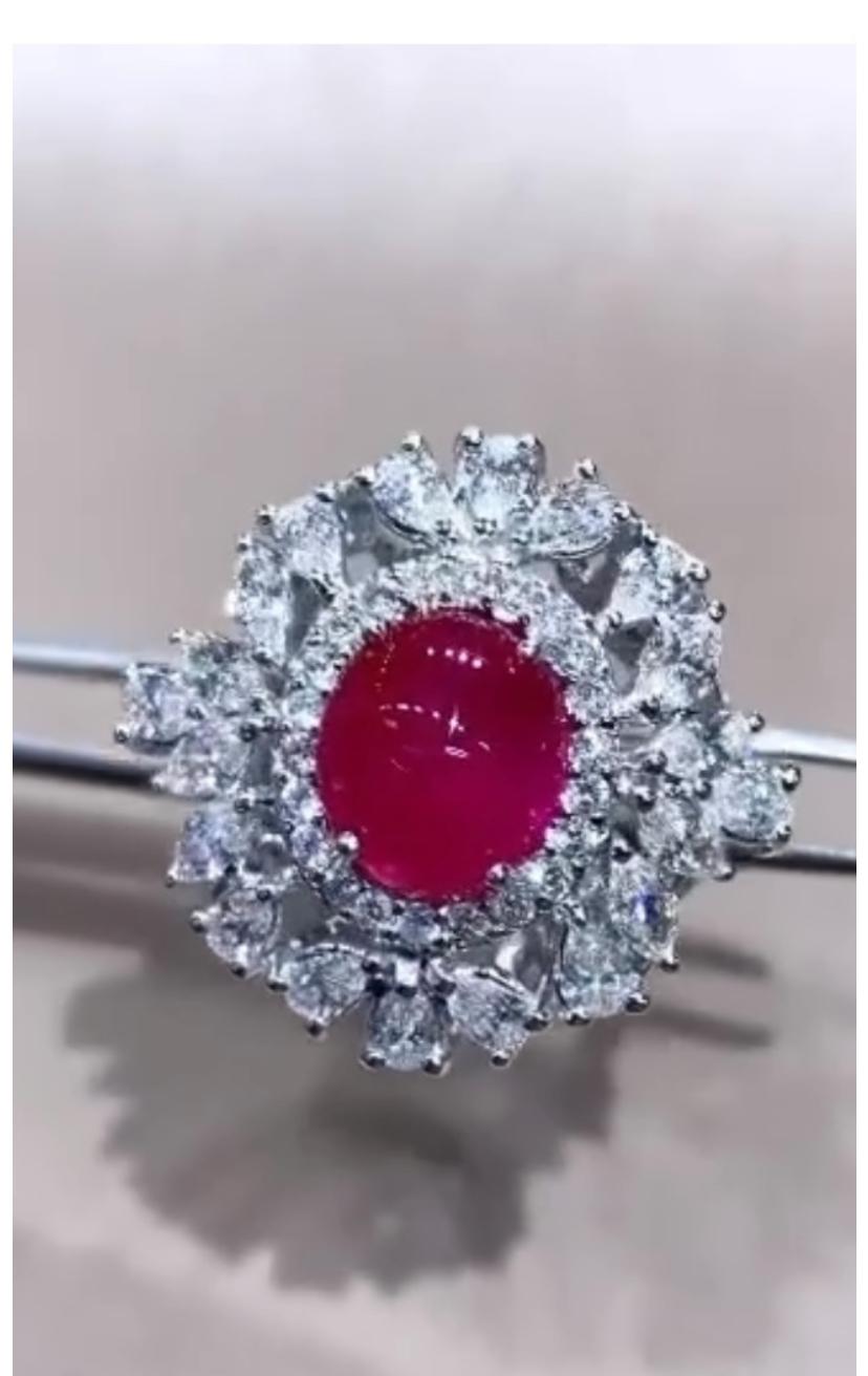 Introducing an exquisite ring , crafted to perfection. Each gems showcases the vibrant allure of the brilliant red Burma Ruby , enhanced by the radiant sparkly of diamonds. Immerse yourself in the luxurious beauty of this mesmerizing ring, exuding