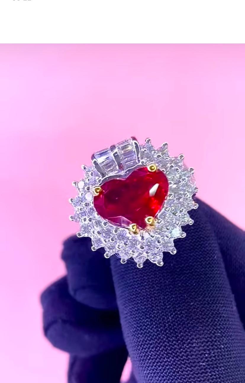 Imagine the pure delight in unwrapping a piece of timeless elegance from our new collection of jewels, ready to outshine every other moment in your life .
Our exquisite ring showcases a mesmerizing 4,20 carat of heart shape vivid  red ruby, common