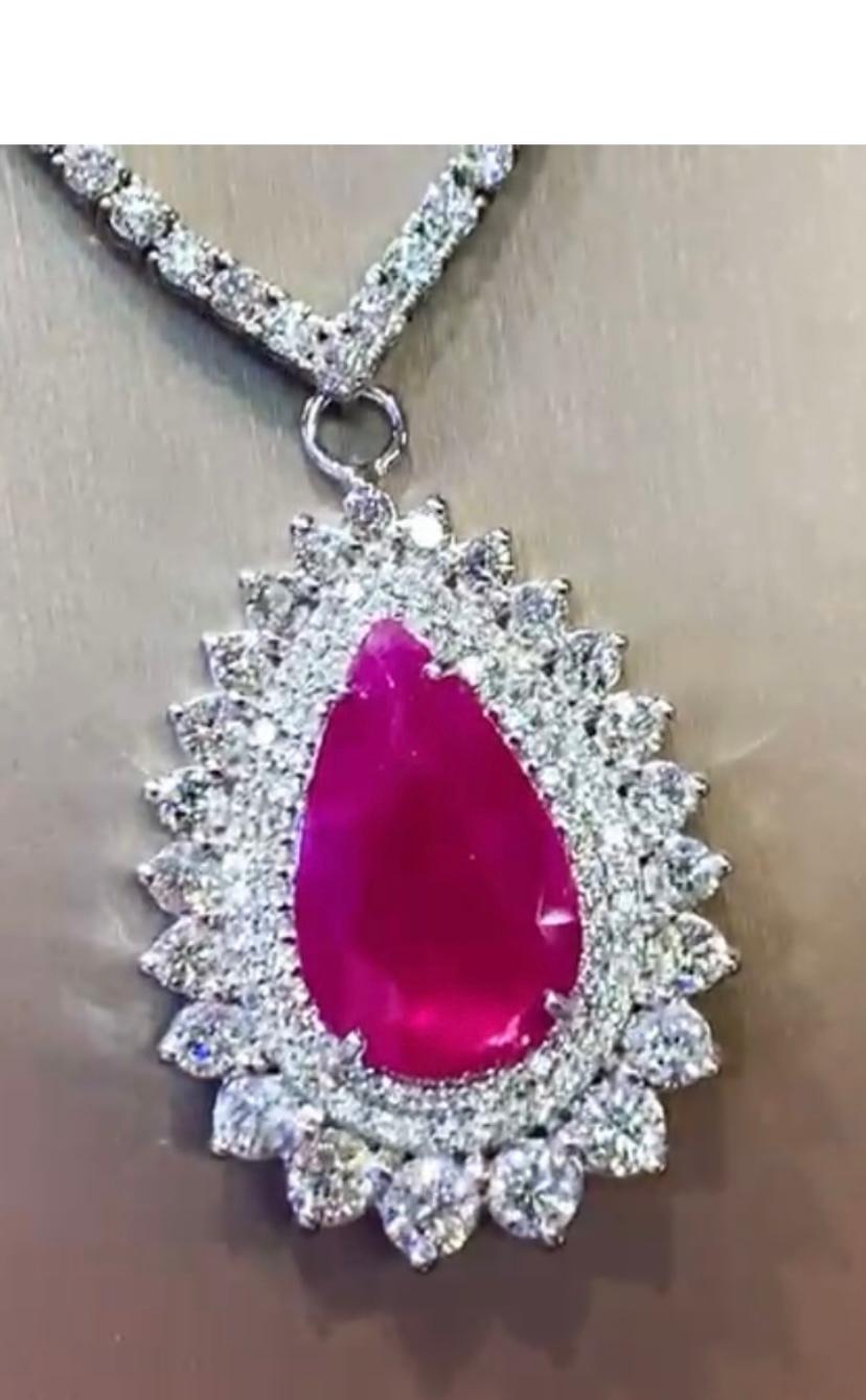 Exclusive and refined design for this beautiful pendant in 18k gold with a natural Burma Ruby 
of 5,50 carats, in perfect pear cut , fine grade, excellent quality, spectacular color , and round brilliant cut diamonds of 3,26 carats,