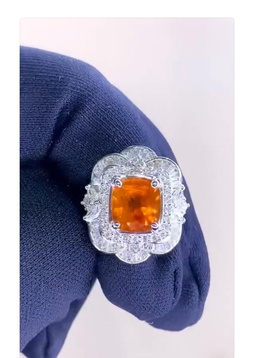 An exclusive orange sapphire and diamonds ring, in refined and glamour design.
Elevate your look and adds a touch of color and sophistication on your outfit.
Stunning ring  come in 18k gold with a Natural Sapphire of 6,30 carat, spectacular vibrant