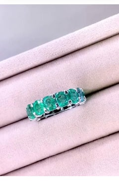 18K Gold Eternity Band with 6.40ct Natural Emeralds