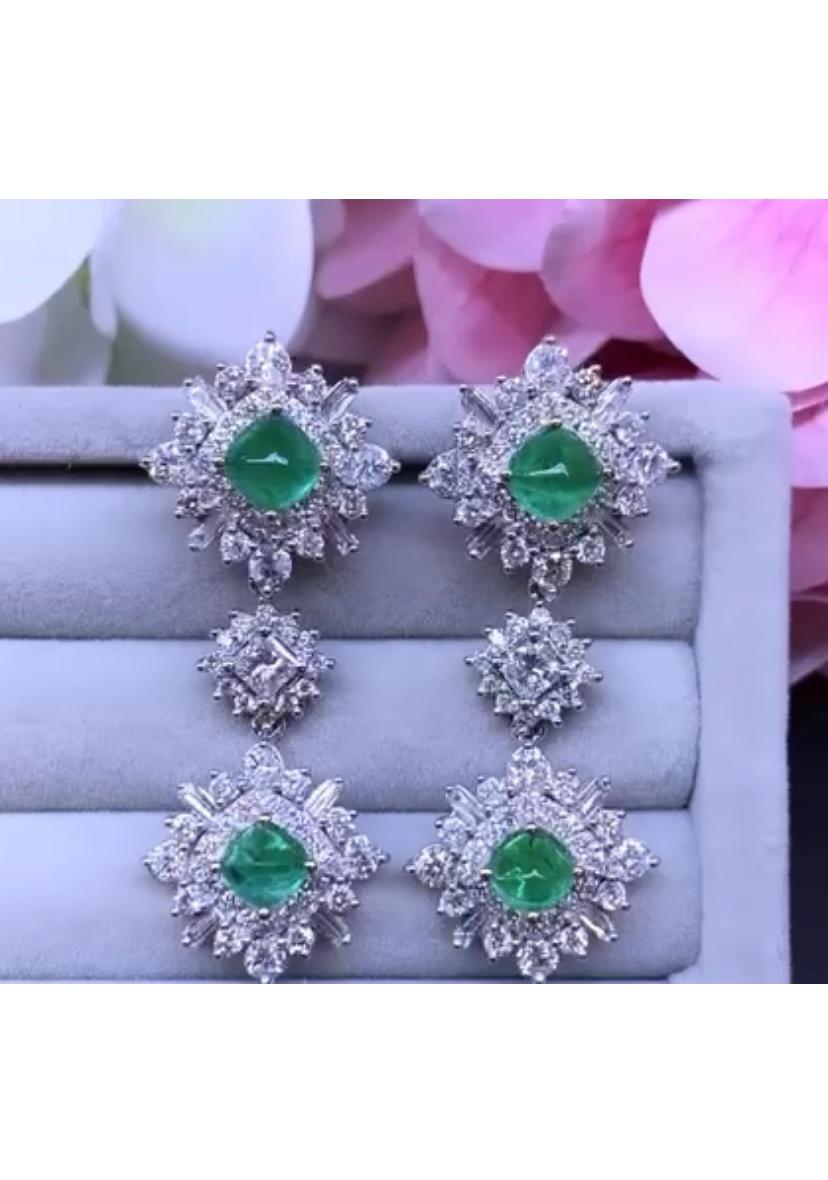An exclusive design, so glamour and refined, exclusively handmade. Earrings come in 18k gold with four pieces of Zambia emeralds, fine quality, in cabochon cut, of 5,40 carats, and natural diamonds in baguettes and round brilliant cut of 6,80 , F