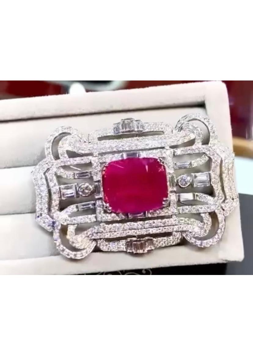 An exquisite Art Deco design brooch/pendant in 18k gold, so glamour and chic style.
Brooch/pendant come with a natural Burma ruby of 6,90 carats, fine grade , and 332 pieces of natural diamonds of 4,62 carats, F color and VS clarity.  It is a very