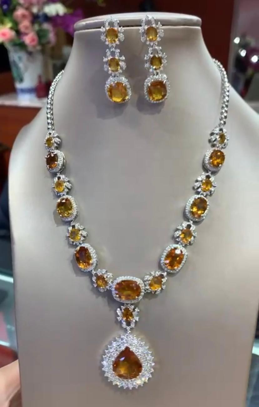 Oval Cut AIG Certified 71.60 Carats Orange Sapphires. 7.31 Ct Diamonds 18K Gold Parure  For Sale