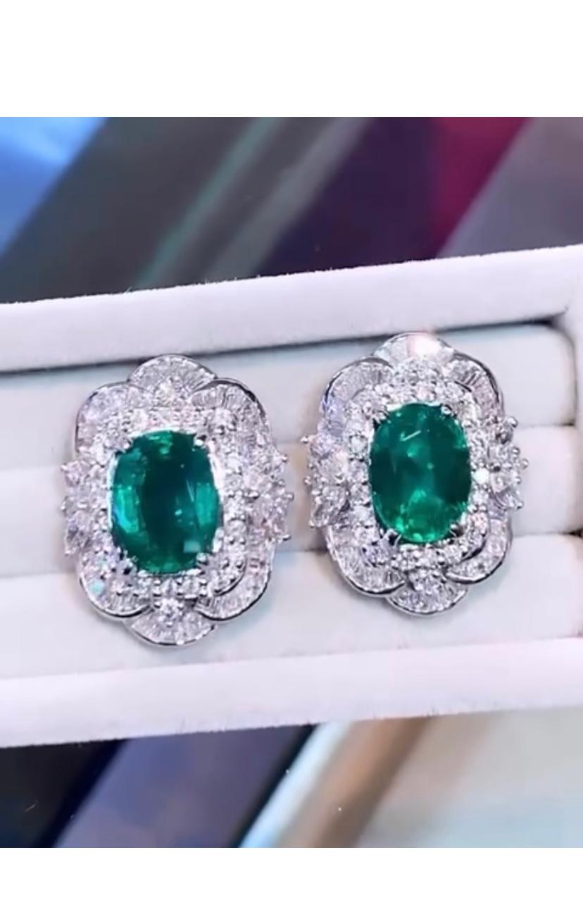An exclusive earrings in Art Deco design, so sophisticated and gorgeous, an a very piece of art . Earrings come in 18k gold with 2 pieces of natural Zambian in perfect oval cut, fine quality, 7,36 carats, vivid green, and 146 pieces of natural