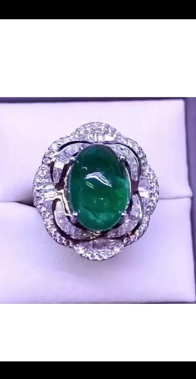 Gorgeous flowers design for this refined and chic ring , a very exclusive style.
Ring come in 18k gold with natural Zambia Emerald in perfect oval cabochon cut of 7,64 , fine quality, amazing color and grade, and baguettes and round brilliant cut