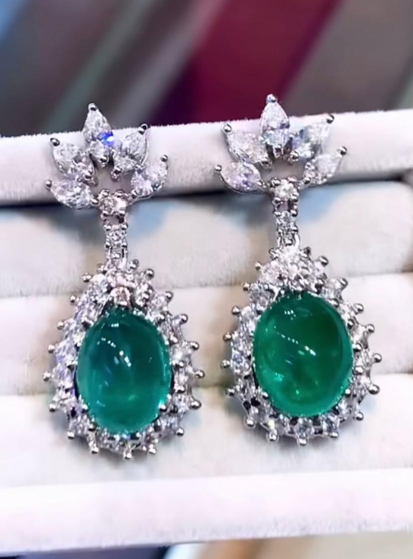 An exquisite design, so particular and refined, perfect for glamour ladies, by Italian designer.
Earrings come in 18K gold with 2 pieces of natural Zambian Emeralds , in ideal pear cabochon cut , spectacular vivid green , fine quality, of  7,73