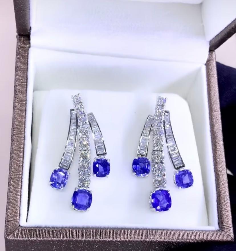 An exquisite and captivating sapphires and diamonds earrings. The oval cut sapphires adds a touch of elegance and uniqueness to the earrings. The sapphires stones are a striking cornflower blue Ceylon, reflecting the beauty and allure of this