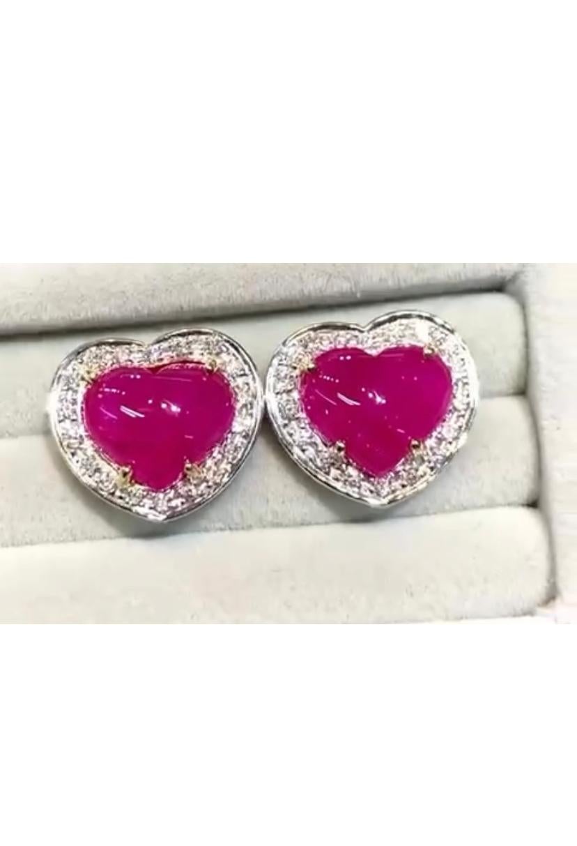 So lovely and original style, from heart collection, design is very refined and chic. 
Earrings come in 18k gold with two pieces of Burma rubies, cabochon heart cut , of 8,15 carats, and round brilliant cut diamonds of 0,65 carats, 
F color and VS