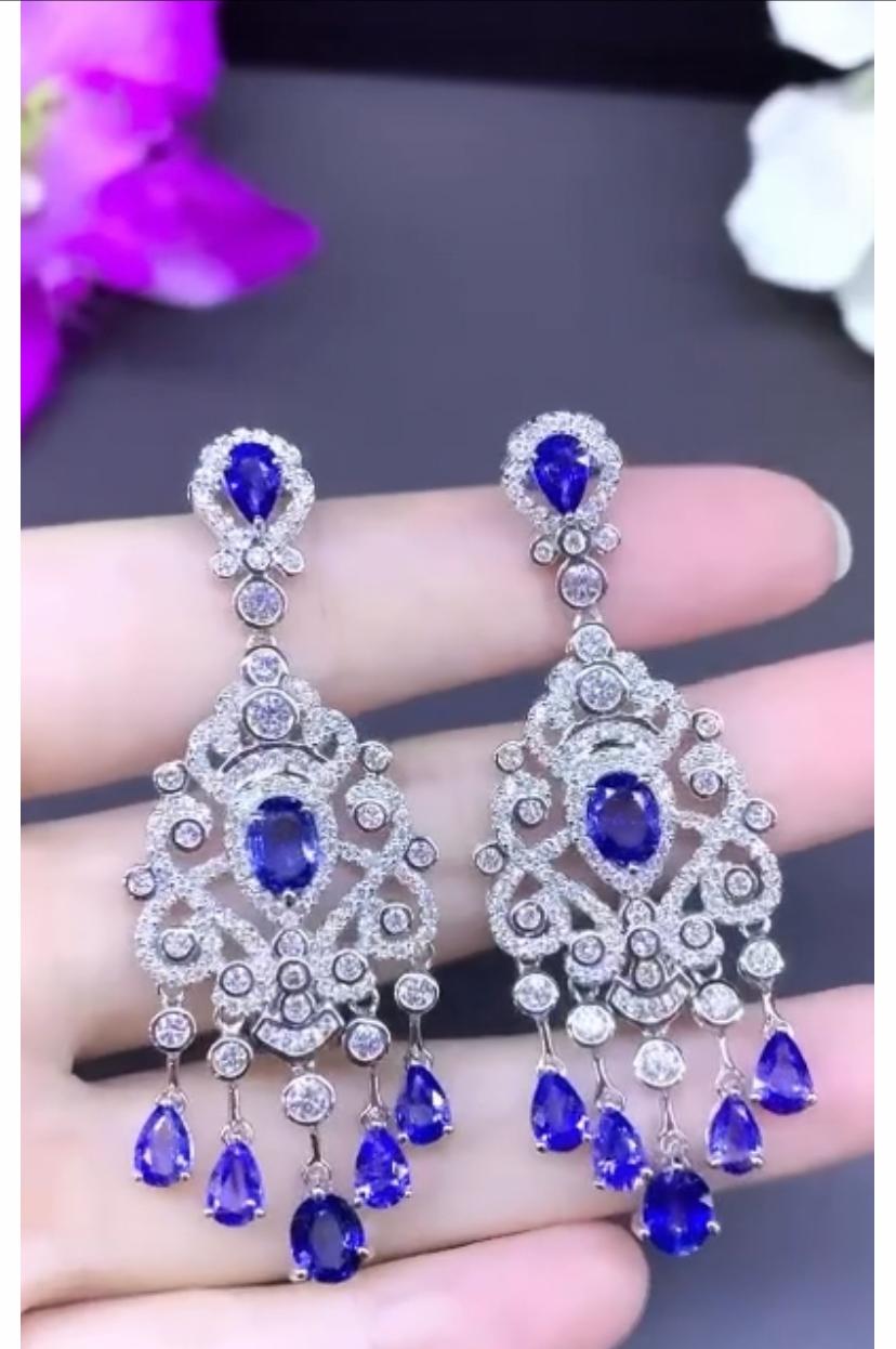 A magnificent pair of earrings in stunning design, so exclusive and sophisticated, a very piece of art . Earrings come in 18K gold with 14 pieces of natural Ceylon Sapphires in sweet cornflower blue, extra fine quality and grade, full transparent,