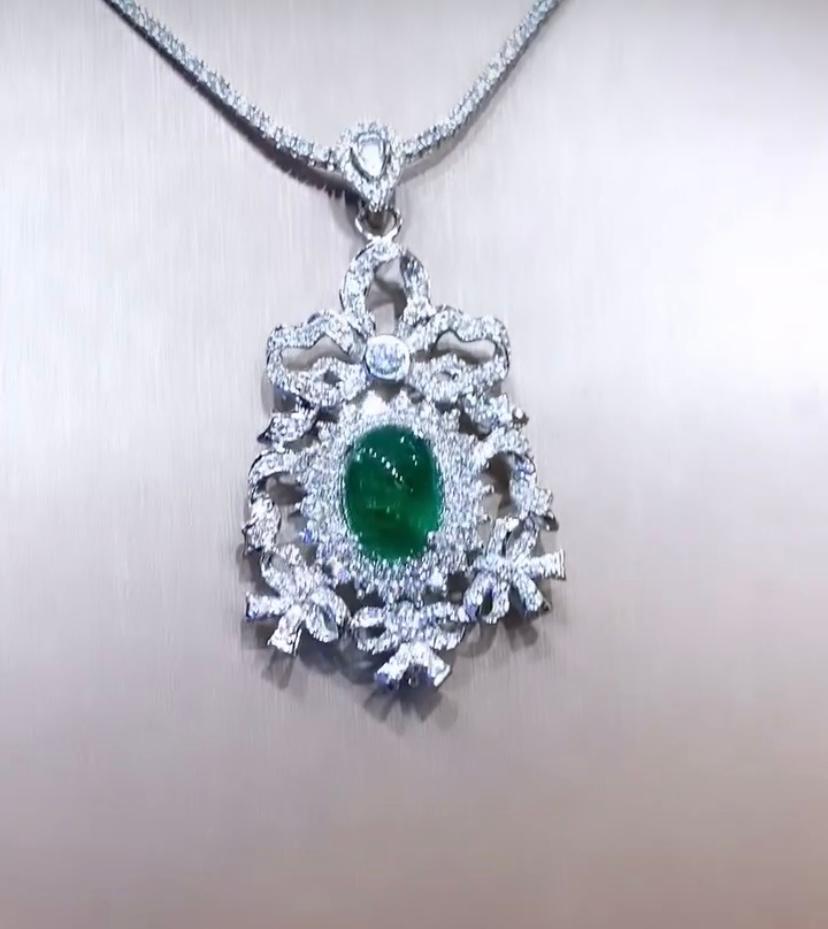 An exquisite pendant, in Art Deco design, so particular, elegant, a very adorable style.
Pendant come in 18K gold with a central Natural Zambian Emerald of 8,70 carats, in perfect oval cabochon cut , extra fine quality, CEO minor , spectacular color
