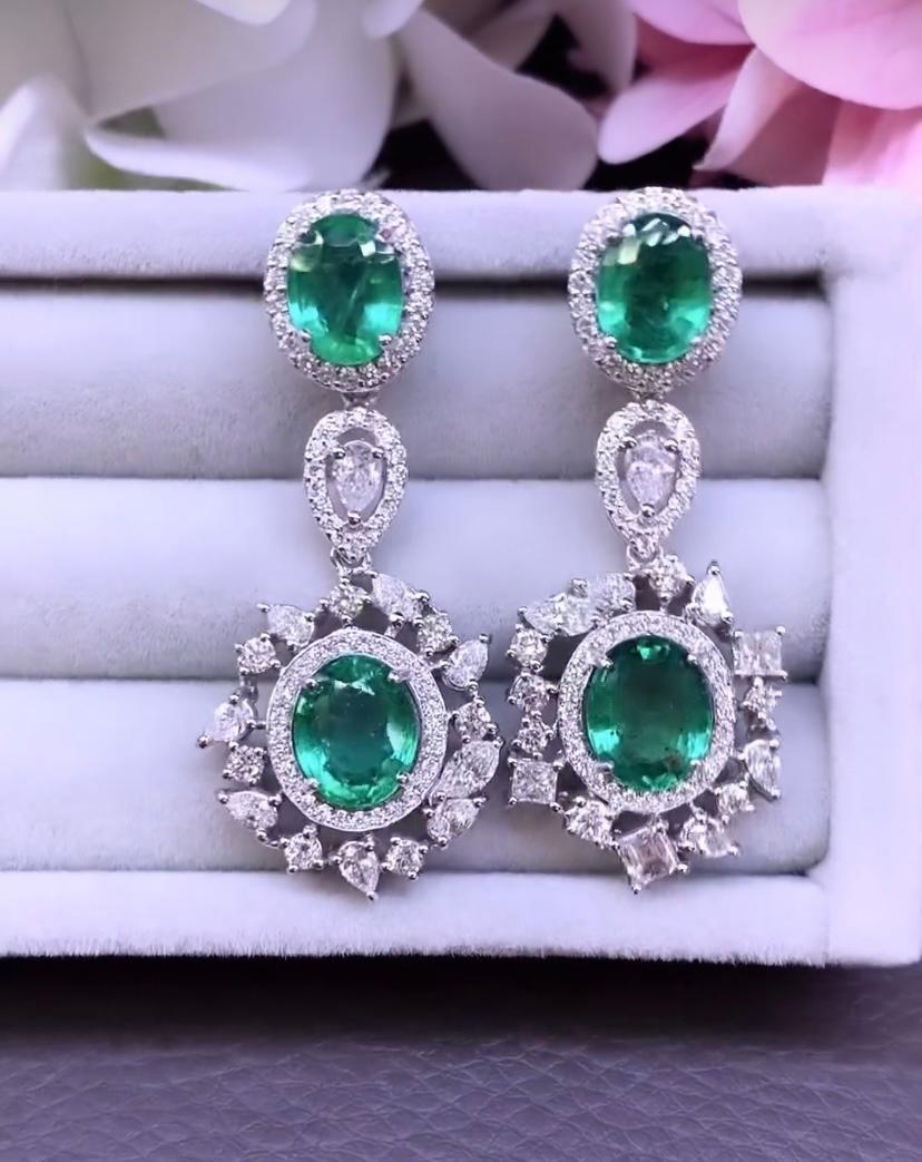 Oval Cut AIG Certified 9.10 Carats Zambian Emeralds   3.00 Ct Diamonds  18K Gold Earrings For Sale