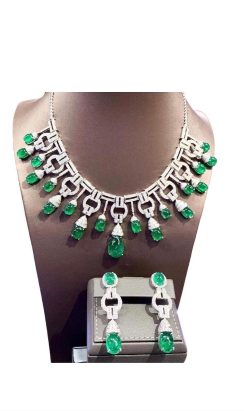 An exceptional Art Deco style parure, complete with earrings and necklace, so stunning and refined , a very piece of art. 
Necklace come in 18k gold with natural Emeralds from Zambia, extra fine quality, in cabochon cut of  91.85 carats, and 640