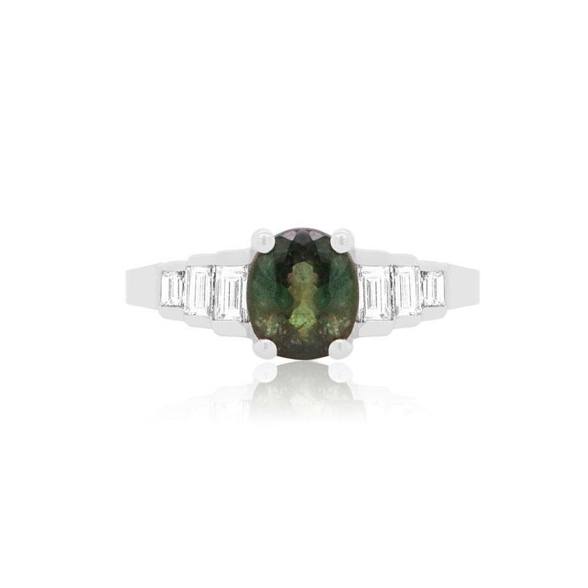 AIG Certified Stone 
Material: 18K White Gold
Center Stone Details: 1 Oval Alexandrite at 2.41 Carats - Measuring 9.5 x 7 Millimeters
Side Stone Details: 6 Baguette Diamonds at 0.52 Carats Total Weight
Color/Clarity: H-I / SI

Fine one-of-a-kind