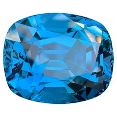 Gema de topacio azul de Londres natural certificada por AIG: 69.24 quilates talla cojín