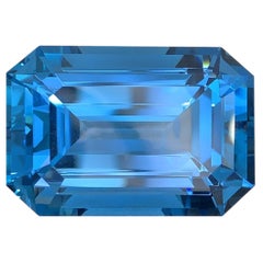 Gema de topacio azul de Londres natural certificada por AIG: 74,85 quilates talla octágono