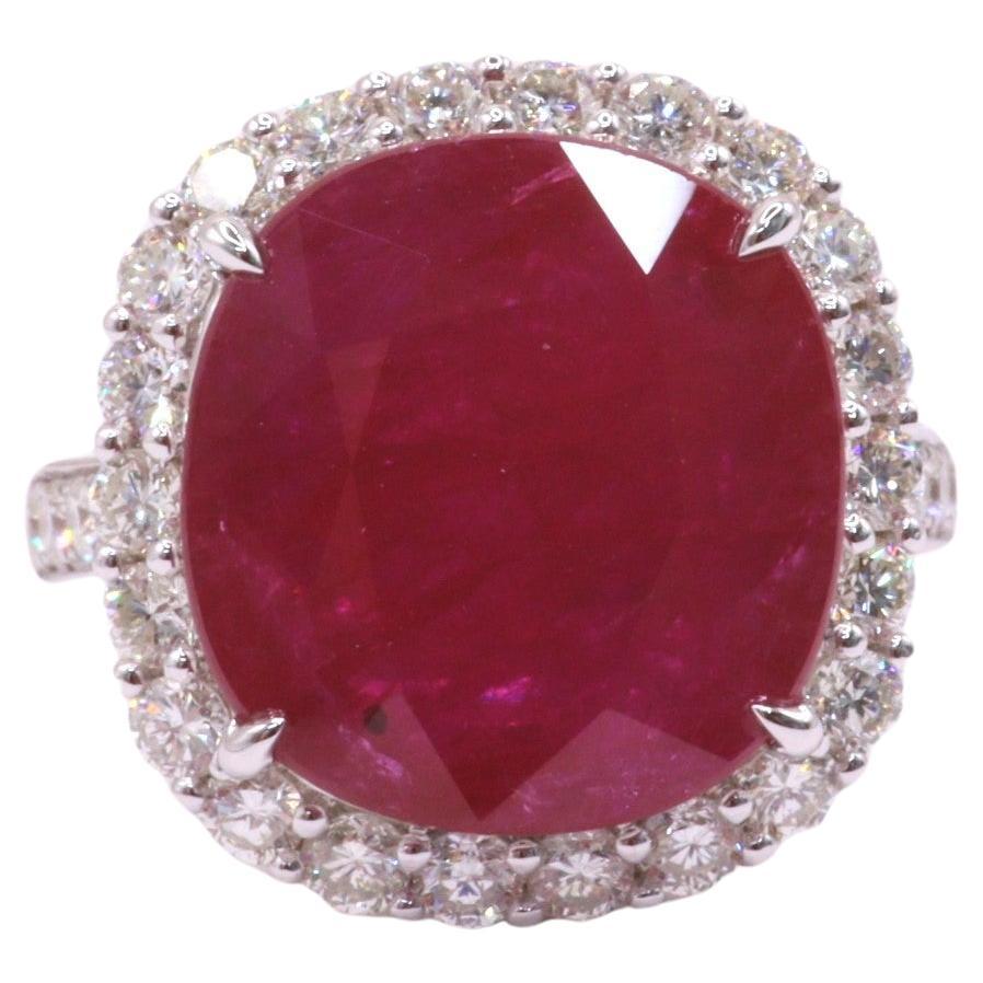 Presenting a truly mesmerizing piece, behold the AIG Certified rare 9.08 Carat Burmese Ruby Ring in vivid red color, boasting a cushion shape that is sure to captivate any admirer. Set in 18K white gold, this modern-style ring is adorned with the