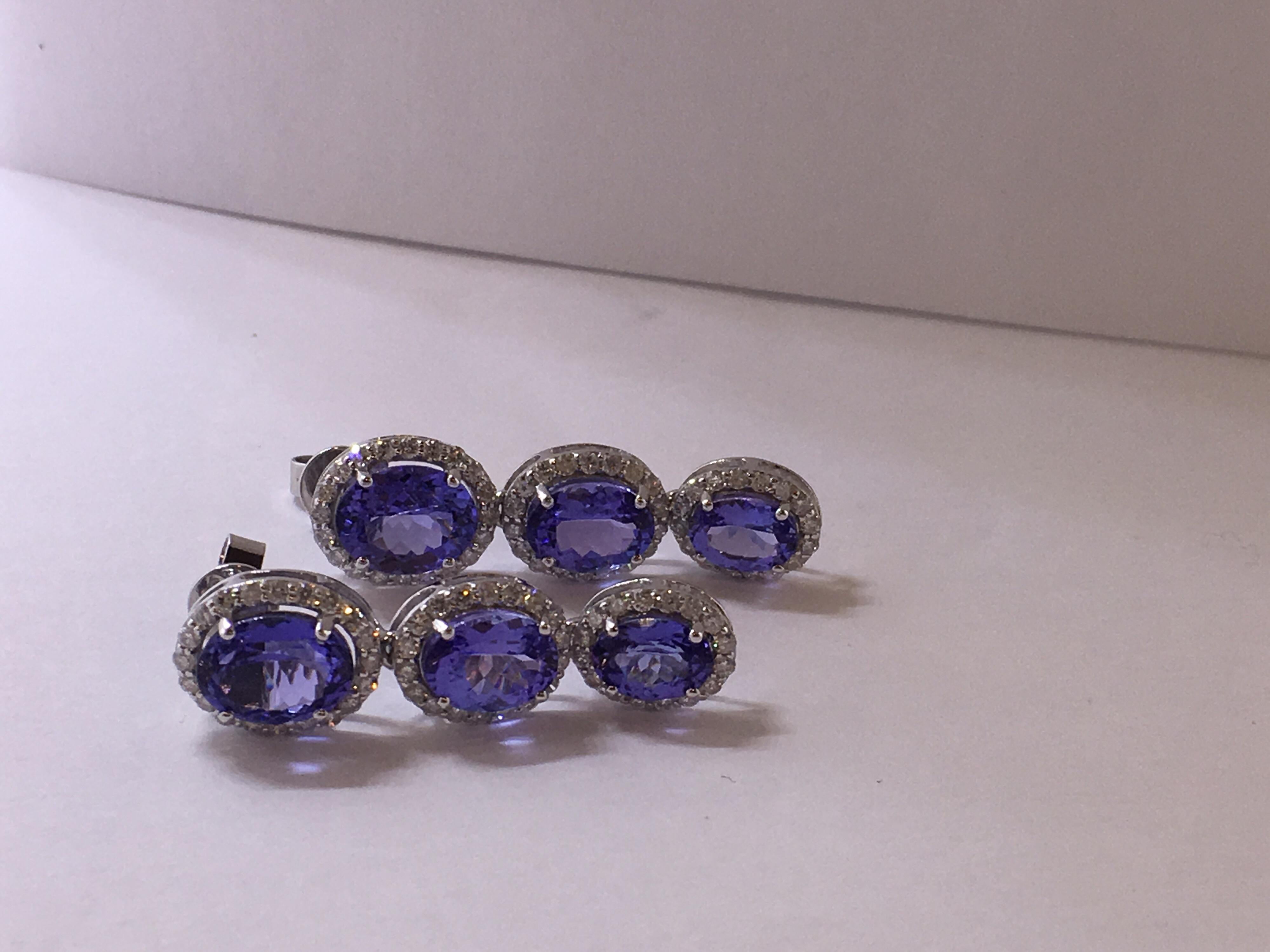 Natural Certified Tanzanite and Diamonds set in 14 Karat White Gold is one of a Kind Dangle earrings with screw back. Total weight of  Tanzanite is 8.49 Carat and Total ( Color G-I ) Diamonds 1.19 carat.Total weight of the earrings is 6.80 Gram.