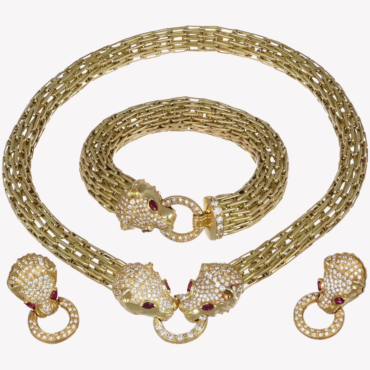 Resplendent symbol of power and prestige, this panther-shaped parure in 18kt yellow gold is a triumph of jewelry craftsmanship. The panther heads, with 