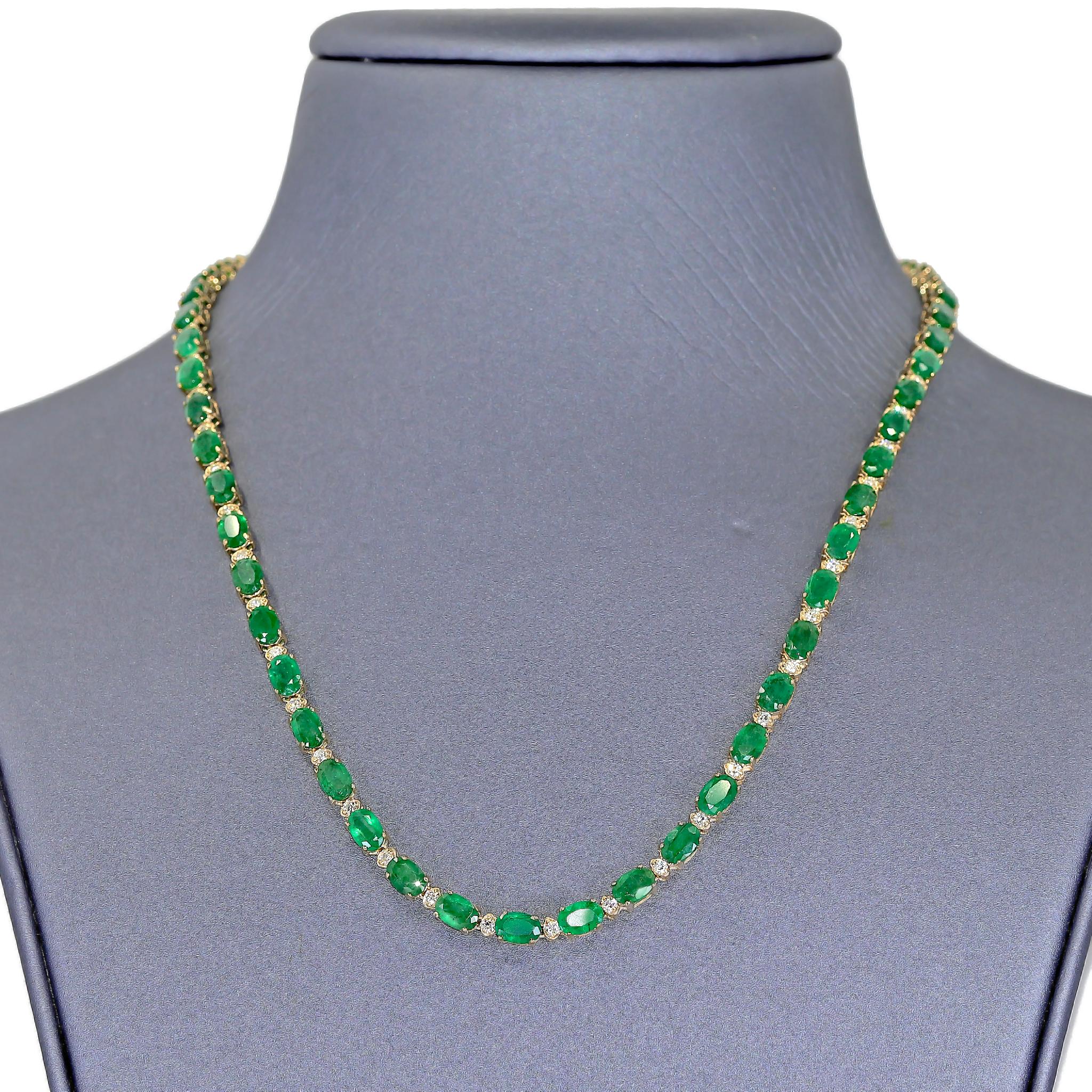 Magnificent Emerald and Diamond Necklace in 14k yellow gold featuring 46 matched, completely natural, faceted oval emeralds totaling 32.00 carats, individually prong-set and flanked with 46 shimmering round brilliant-cut white (H-I/SI1) diamonds
