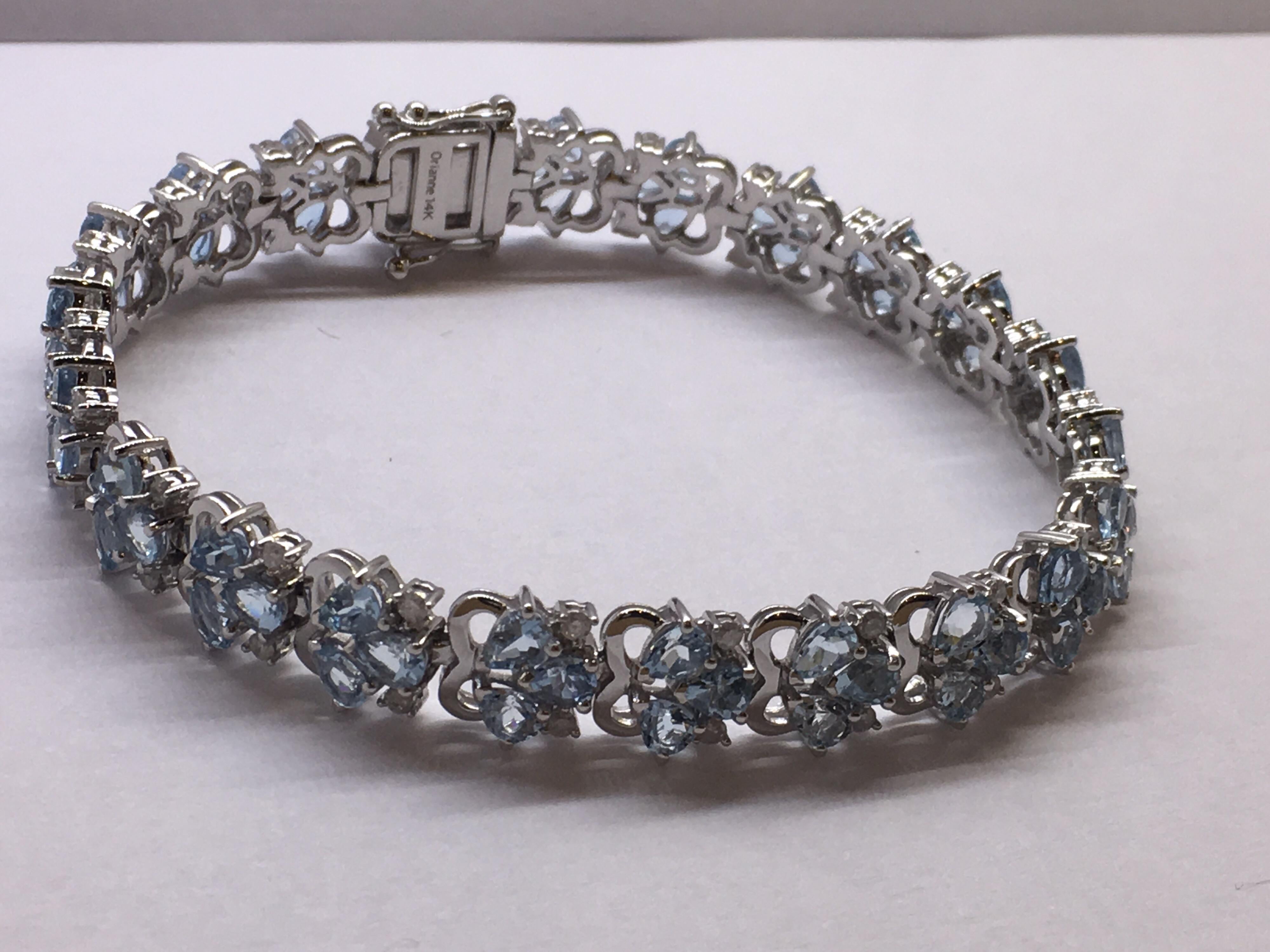 Pear shape Aquamarine and Round Diamonds set in 14 Karat White gold is a one of a kind Handcrafted Bracelet. Total Weight of Aquamarine is 9.43 Carat and Total weight of White Diamonds ( Color H-J ) is 0.84 Carat.Total weight of Bracelet including