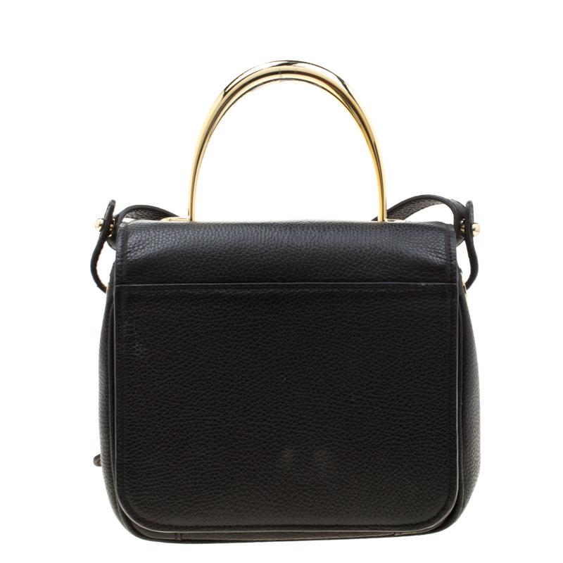 Add a touch of sophistication to your dress with this beautiful leather handbag. This bag lined with the finest fabric lining is a one-stop fashion accessory for all your needs. Aigner showcases a masterfully designed hand bag from its collection of