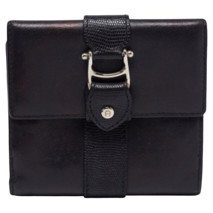 Cartera compacta tríptico de piel negra Aigner