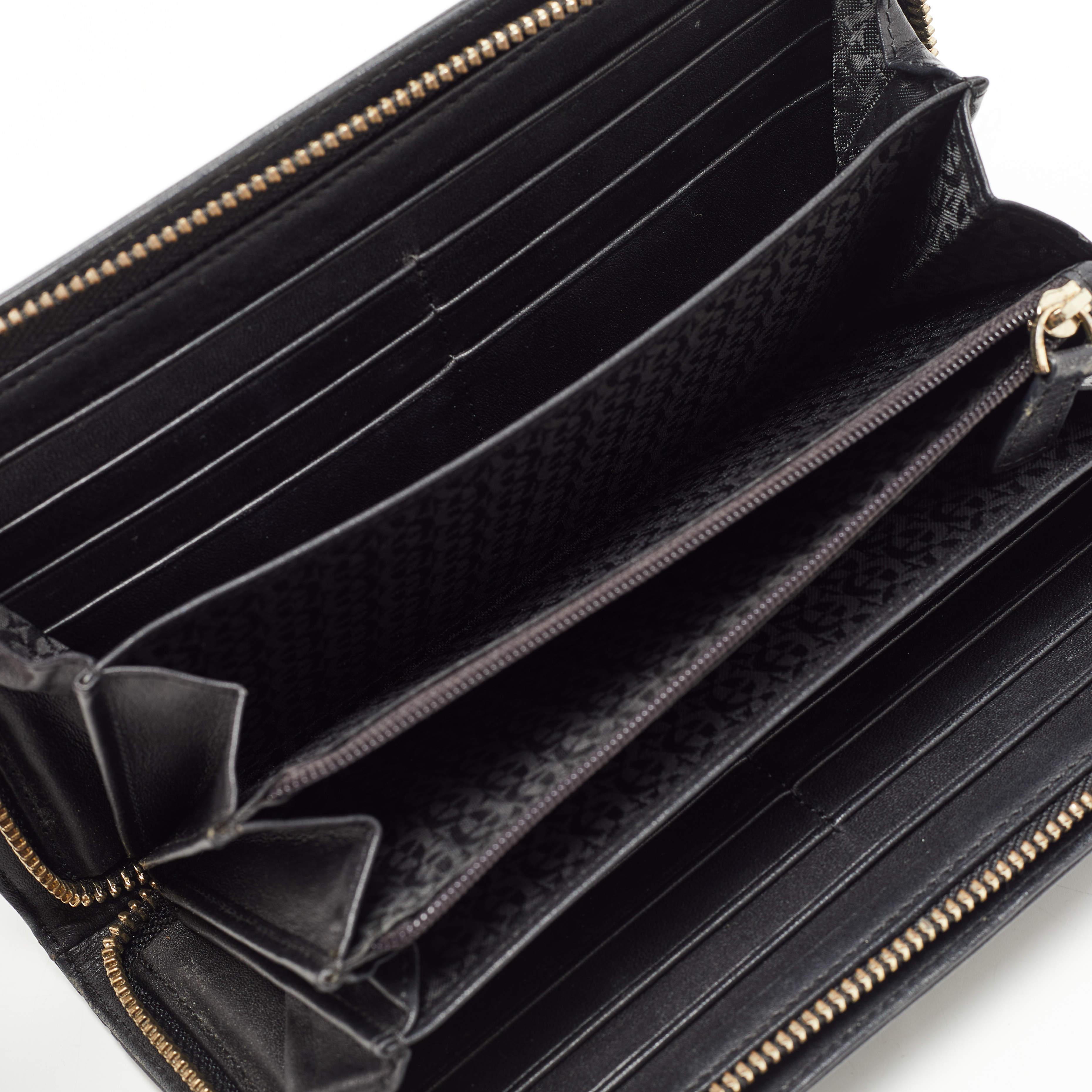 The zip around closer of this Aigner wallet is equipped with a tassel slider. Made from woven leather  it has been paired with intricate patterns and a brand signature on the front. The compartmentalized interior has been lined with fabric.