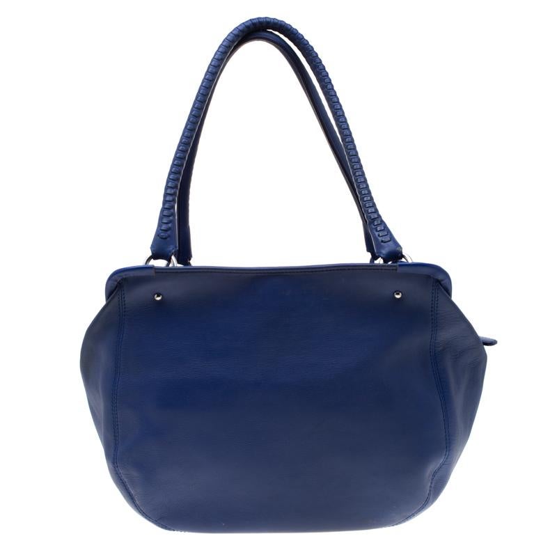 You can never go out of style with this smart and trendy Aigner bag. Crafted from leather, this creation is splendid for toting the essentials on a day trip. The fabric-lined interior provides space for keeping all your valuables and the handles are